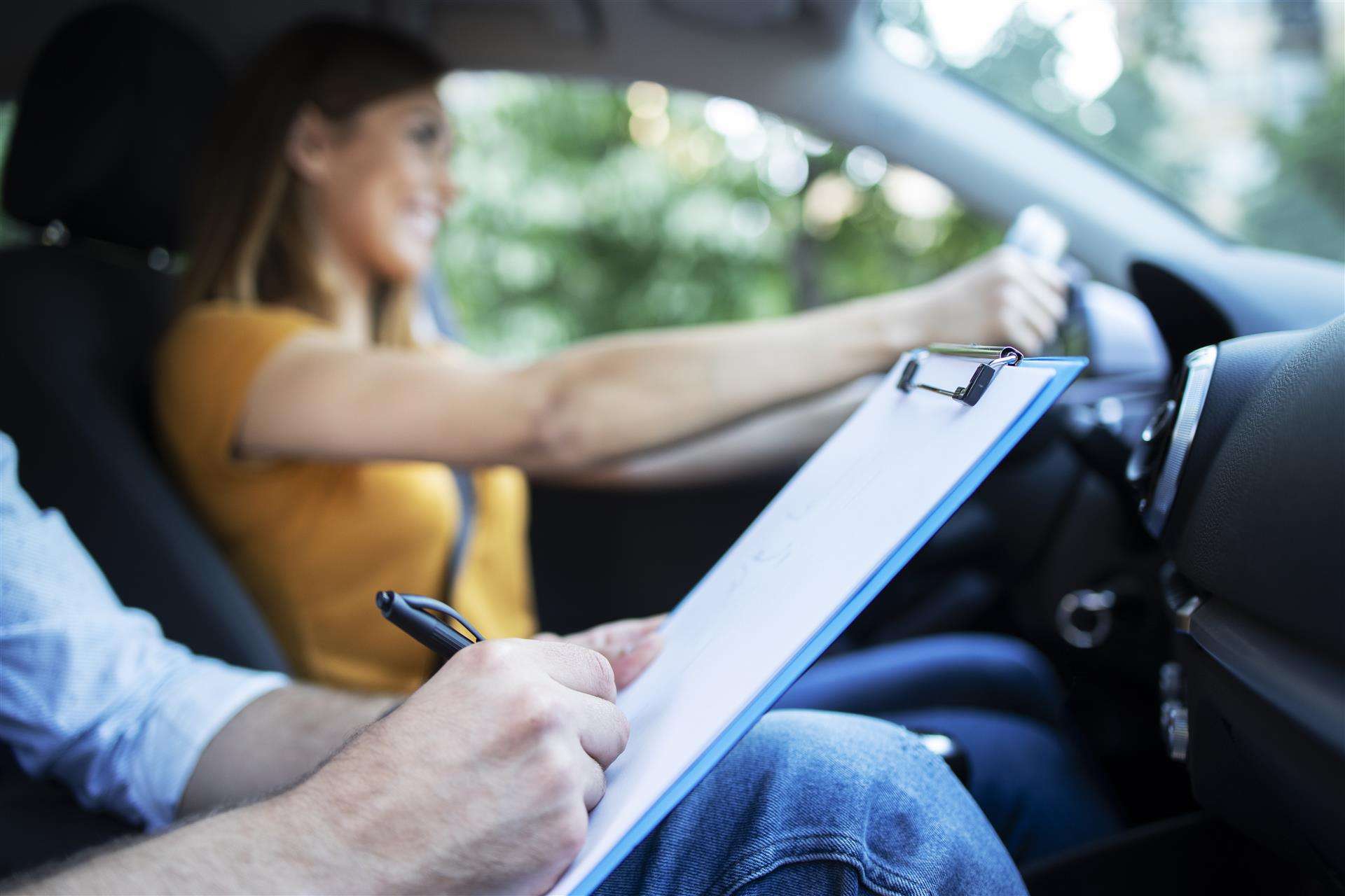 Woman test driving at Staten Island car dealerships, Ideal Auto Sales Staten Island.