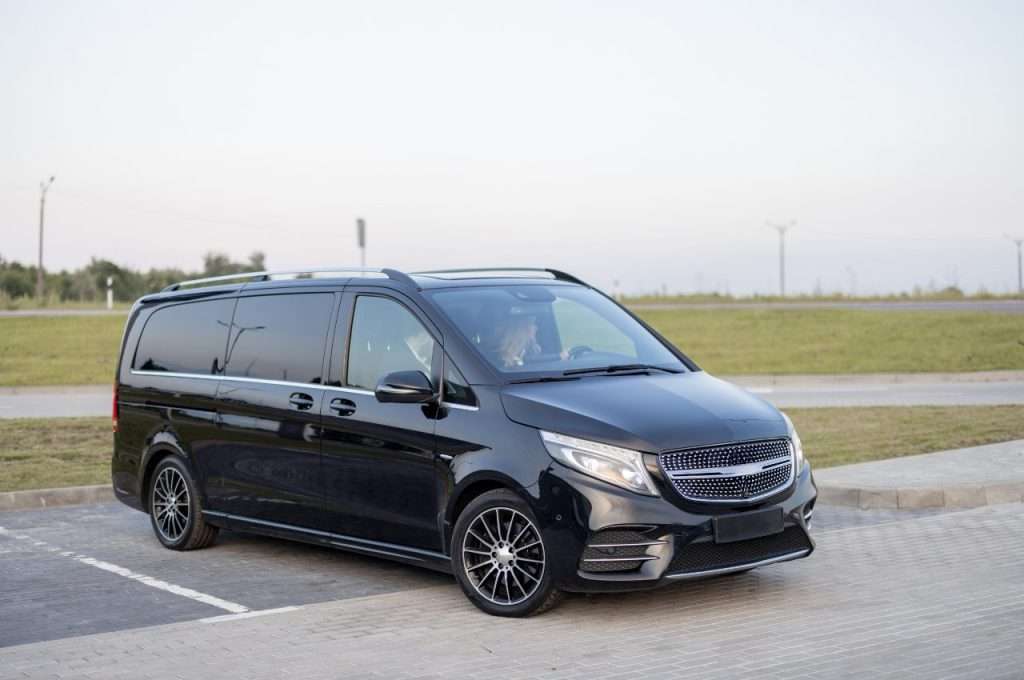 Black van on a parking lot, ideal for Staten Island car dealerships.
