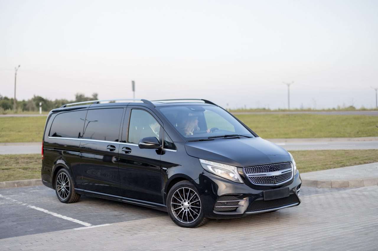 Black van on a parking lot, ideal for Staten Island car dealerships.