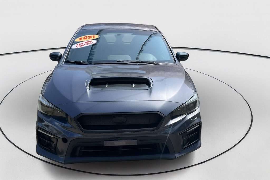 Front view of a 2021 blue sedan at Staten Island car dealerships, Ideal Auto Sales Staten Island.