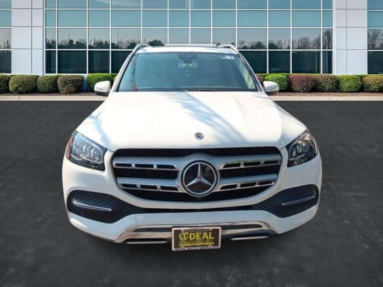 Front view of a white car at Ideal Auto Sales, a Staten Island car dealership.
