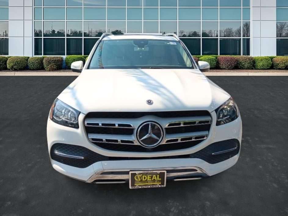 Front view of a white car at Ideal Auto Sales, a Staten Island car dealership.