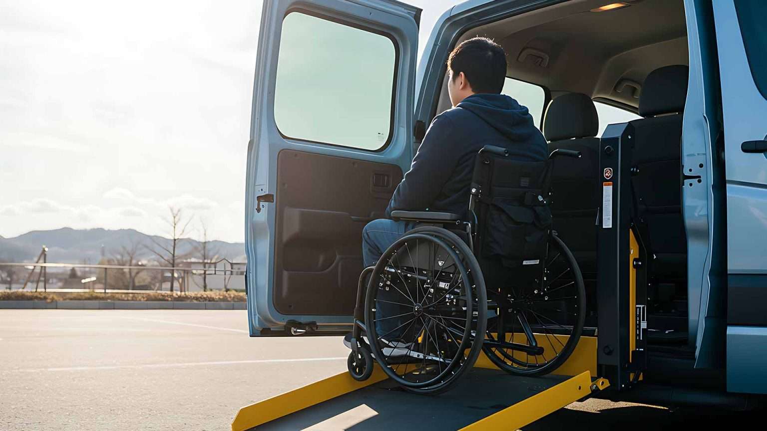 Wheelchair user entering an accessible van at a used car dealership, featuring inclusive used cars for sale at trusted car dealerships.