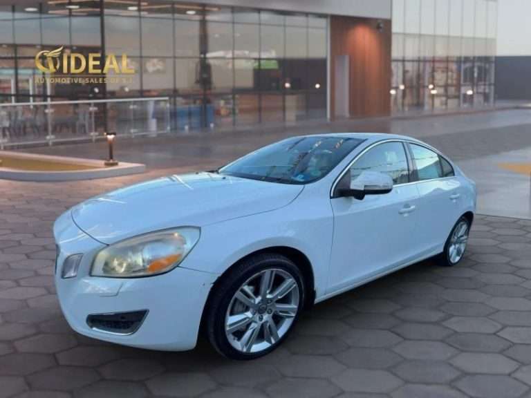 2012 Volvo S60 white luxury sedan parked outside a car dealership in Staten Island
