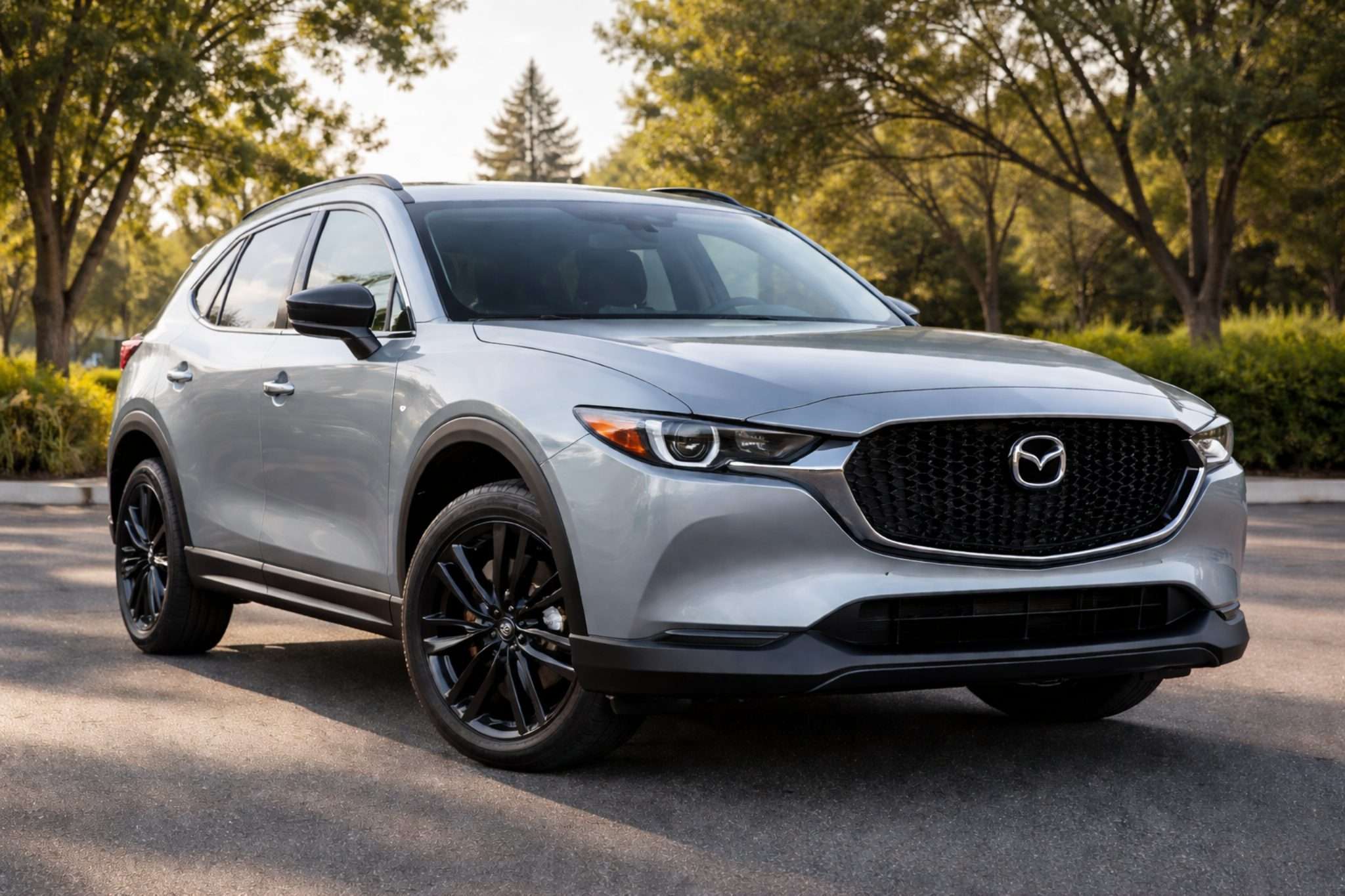 2025 Mazda CX-5 compact SUV parked outdoors showing front grille and LED headlights, popular SUV lease option in Staten Island