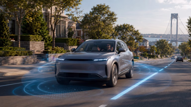 Full self driving car using lane-detection sensors on a Staten Island parkway, shown at iDeal Auto Sales of Staten Island.